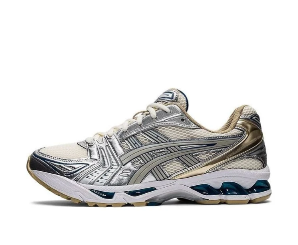 Side view of an ASICS GEL-KAYANO 14 sneaker in silver, cream and grey with dark teal sole accents